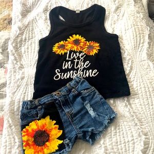 Sunflower racer back tee and distressed denim shorts outfit.